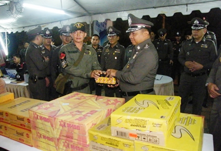 Royal Thai Police Commander-in-Chief Gen. Wichian Potphosri presents energy drinks to officers on duty.